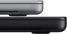 14-inch MacBook Pro with PROLED XDR Display, silver color, stacked on top of 16-inch model, space black color, showing size difference